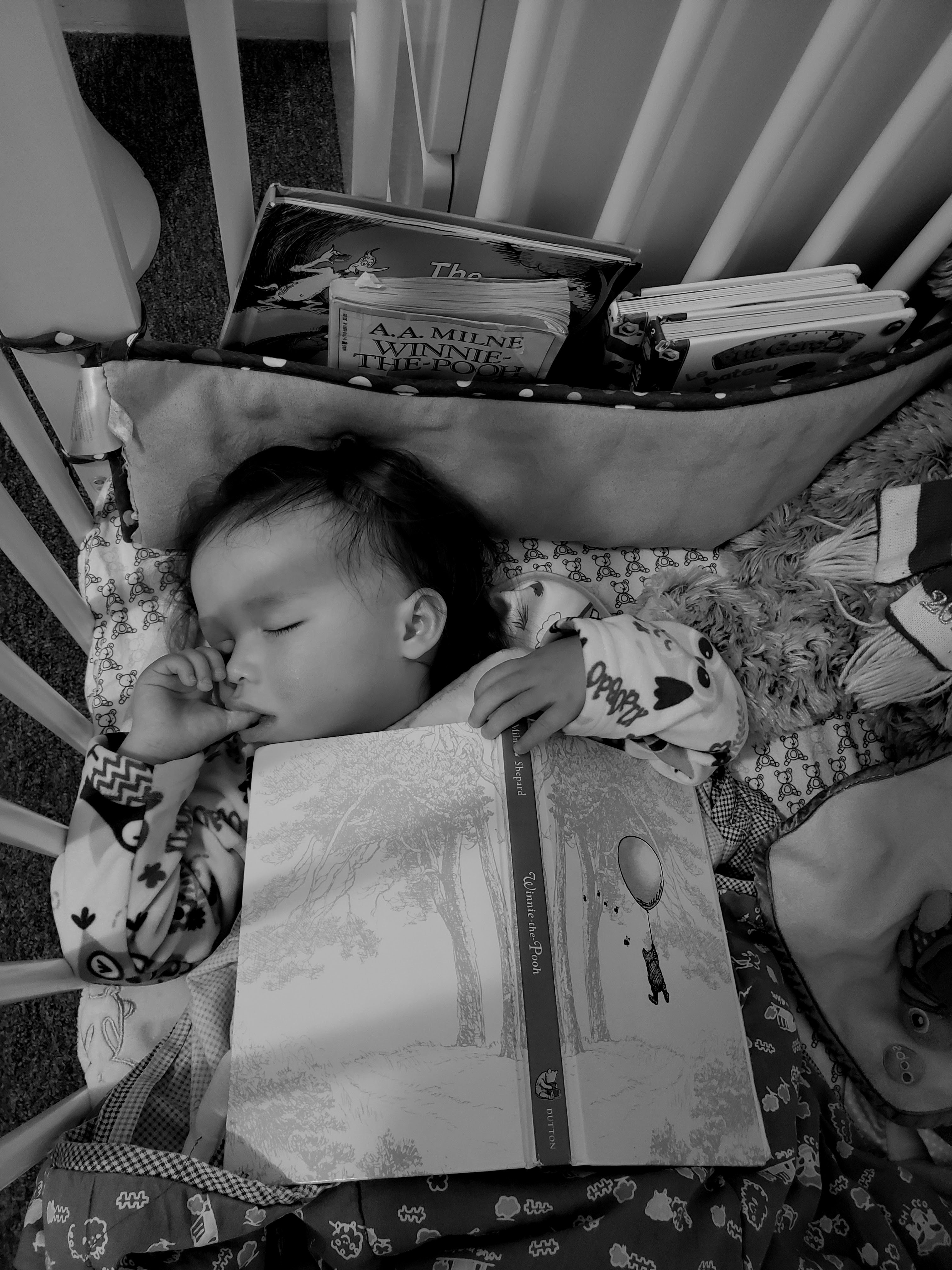Baobao, age 2, asleep with Winnie-the-Pooh